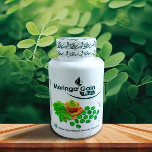তাজা সবুজ মরিঙ্গা পাতার ব্যাকগ্রাউন্ডে Moringa Gain Plus হার্বাল সাপ্লিমেন্ট, যা প্রাকৃতিক শক্তি ও সুস্বাস্থ্যের প্রতীক।