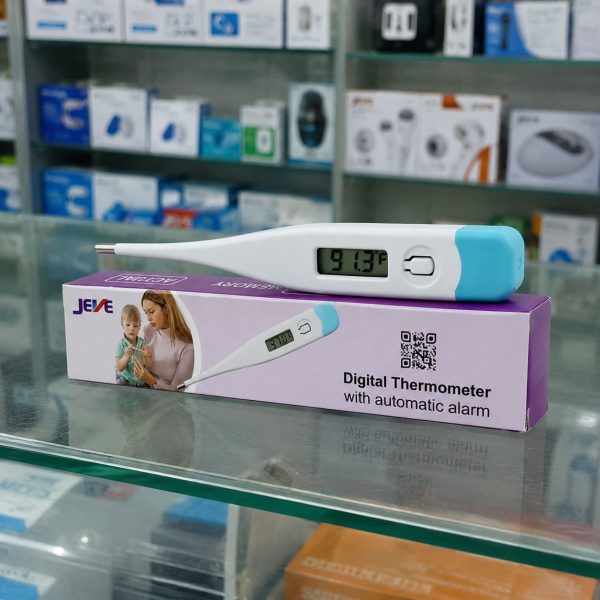 Jeve Digital Thermometer with automatic alarm displayed on product box in a realistic pharmacy display setting